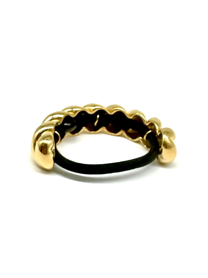 Twisted 18K gold plated hair cuff with a polished finish for delicate and elegant hairstyles.